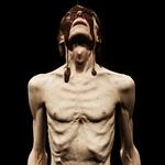 I opsætningens slutbillede står Madame Nielsens nøgne hvide krop til fuld skue foran publikum. Anorektisk afpillet til skind og ben, mens den overmales  af en chokoladeglinsende brun stråle – og ikke mindst alskens racepolitiske værditilskrivninger.   Foto Sofie Klougart.