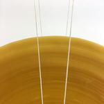 Møbeldesigneren Kasper Kjeldgaard skaber roterende installationer af papir, messing og voks. PR