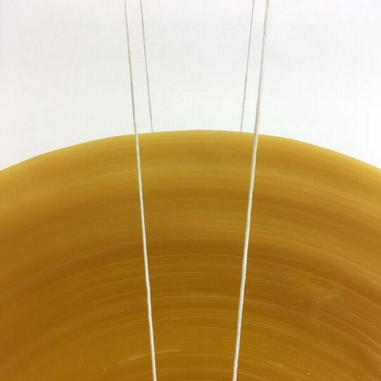 Møbeldesigneren Kasper Kjeldgaard skaber roterende installationer af papir, messing og voks. PR