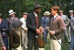 Bagger Vance (Will Smith) og Rannulph Junuh (Matt Damon) får sig en snak om køller. Foto fra filmen 