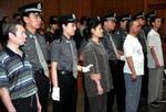 Den øverste folkedomstol i Beijing fandt de fire skyldige i mord. Foto: AP 