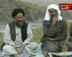 Bin Laden ses på videoen lyttende til sin højre hånds al-Zawahiri. - Foto: AP 