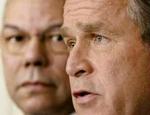 Med udenrigsminister, Colin Powell, ved sin side, sagde en bistert udseende Bush, at spillet er ude. - Foto: AP 