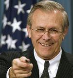 På trods af at Donald Rumsfeld havde svært ved at holde smilet tilbage advarer han alligevel om, at de kommende dage bliver svære. - Foto: AP 