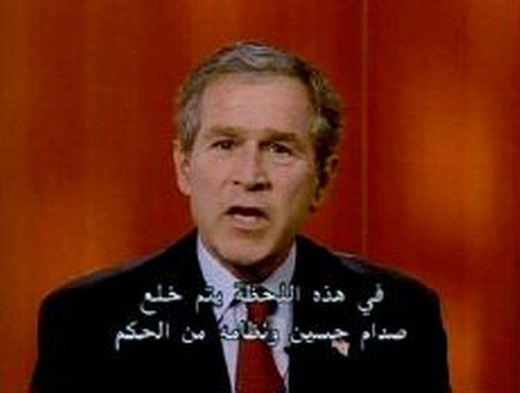 George Bush i talen til det irakiske folk, der var tekstet på arabisk. - Foto: AP 