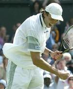 Hewitts banemand, Ivo Karlovic fra Kroatien. - Foto: AP 