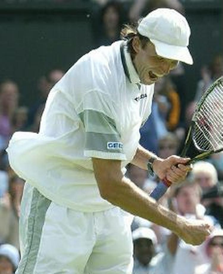 Hewitts banemand, Ivo Karlovic fra Kroatien. - Foto: AP 