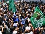 Kisten med den dræbte Abu Shanab var svøbt i Hamas' grønne flag. - Foto: AP 