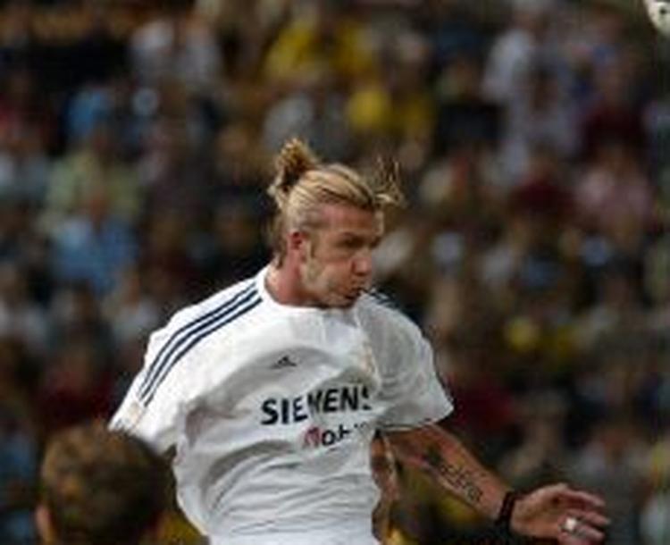 David Beckham gav sig fuldt ud i kampen mod Villareal og lagde op til det udlignende mål. - Foto: AP 
