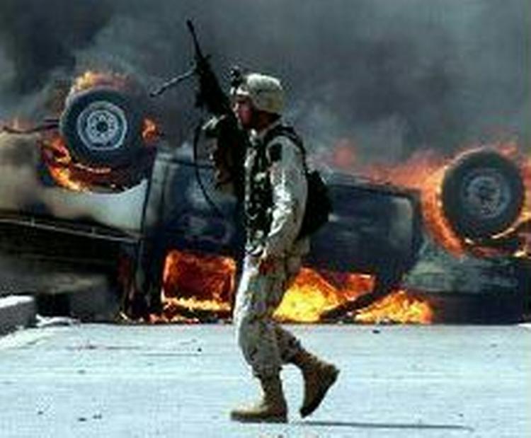 Bush blev før krigen advaret om risikoen for tab af menneskeliv ved en ameri-kansk besættelse af Irak. - Foto: AP 