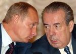 Putin ved siden af Volskij (th), som er chef for en af store arbejdsgiverforeninger i Rusland. - Foto: AP 