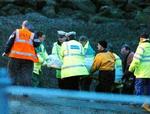 Redningsarbejdere har bjærget ligene 18 muslingesamlere. - Foto: AP 