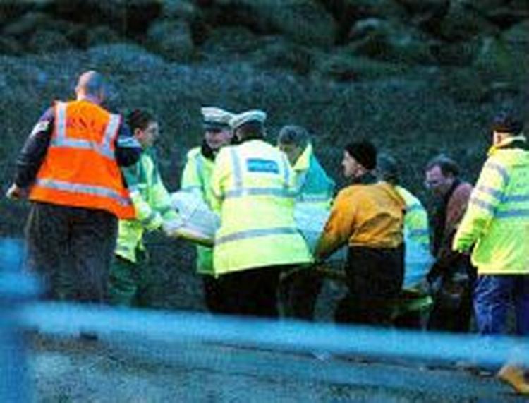 Redningsarbejdere har bjærget ligene 18 muslingesamlere. - Foto: AP 