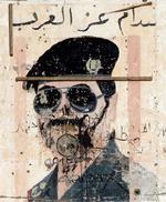 En ødelagt plakat med Saddam Hussein. - Foto: AP 