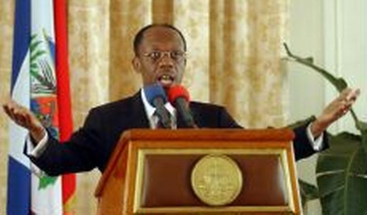 Oprørerne beskylder præsident Jean-Bertrand Aristide for at have snydt sig til magten. - Foto: AP 