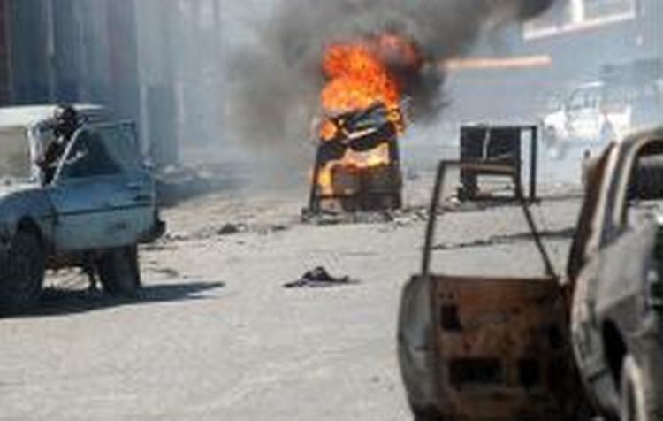 Hovedstaden Port au Prince har i de seneste dage været forvandlet til en krigszone. Nu er der håb om mere fred. - Foto: AP 
