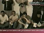 Billede af de fire italienske gidsler i Irak. Kidnapperne kræver, at Italien trækker sig ud af Irak. - Foto: AP 