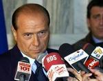 Den ny model beskytter TV2 mod mediemoguler som Silvio Berlusconi. - Foto: AP 