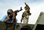 Amerikanerne og oprørerne i den irakiske by Fallujah har aftalt en ny våbenhvile. Ifølge aftalen skal den irakiske hær overtage kontrollen med byen. - Foto: AP 