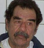Saddam Hussein på et af de billeder, de amerikanske militærmyndigheder udsendte kort efter tilfangetagelsen. - Foto: AP 