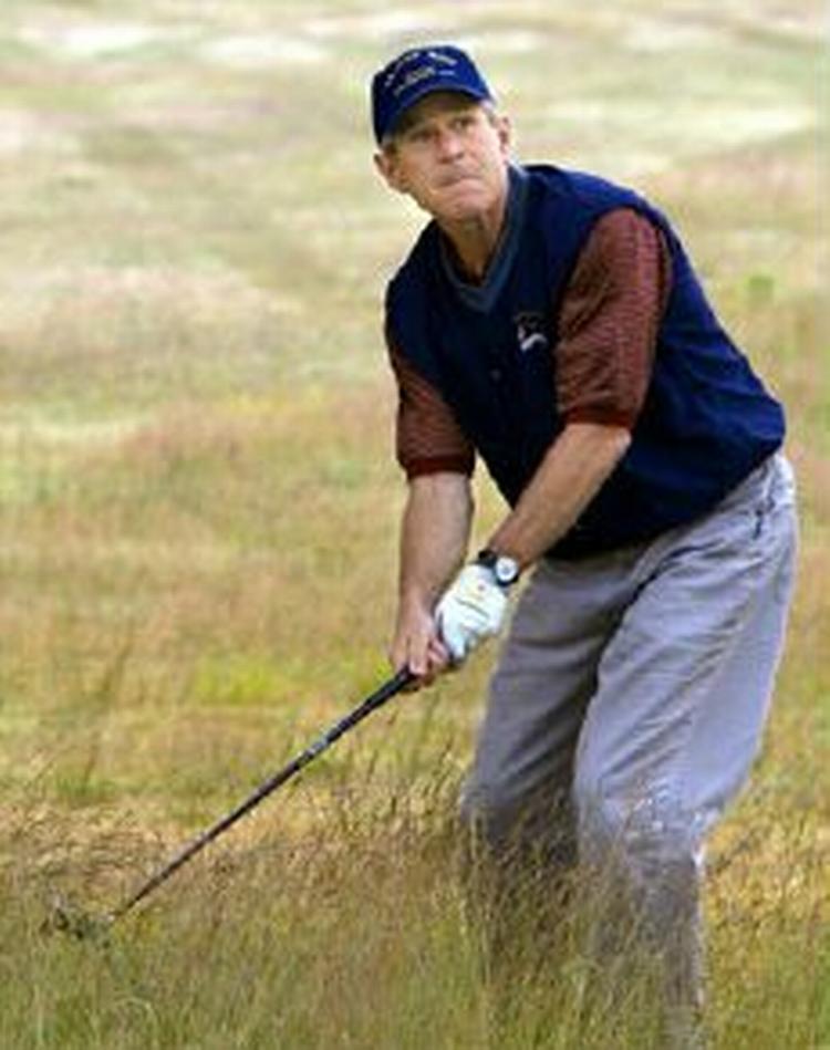 Præsident Bush bliver udstillet i Michael Moores nye film. - Foto: AP 