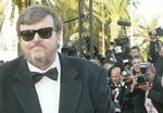 Michael Moore fik guldpalmerne for sin film 'Fahrenheit 9/11'. - Foto: AP 