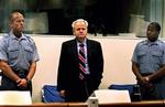 Slobodan Milosevic blev overført til krigsforbryderdomstolen i 2001.   Arkivfoto: Paul Vreeker 