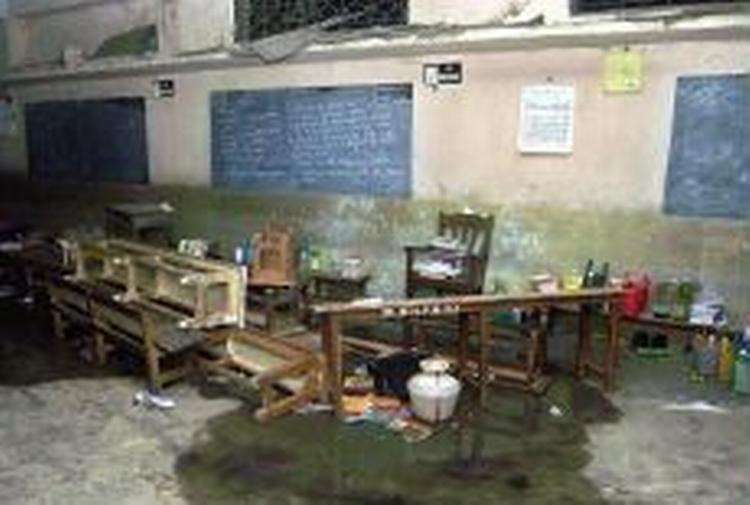 90 børn omkom, da en brand fredag bredte sig eksplosivt fra skolens køkken. - Foto: AP 