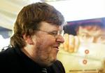 Michael Moore vandt guldpalmerne i Cannes i maj for sin film 'Fahrenheit 9/11'. - Foto: AP 
