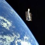 En gruppe astronomer håber at Hubble-teleskopet, der befinder sig i en bane rundt om Jorden kan give det endelige bevis på, at der findes planeter udenfor vores solsystem. - Foto: AP 