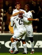 Magne Hoseth (tv.) og Sibusiso Zuma jubler sammen med målscoreren til 2-0, Hjalte Nørregaard.   Foto: Jens Dresling 
