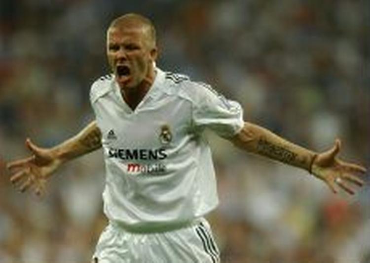 David Beckham jubler efter det lykkedes at komme tilbage i kampen mod Roma. - Foto: AP 