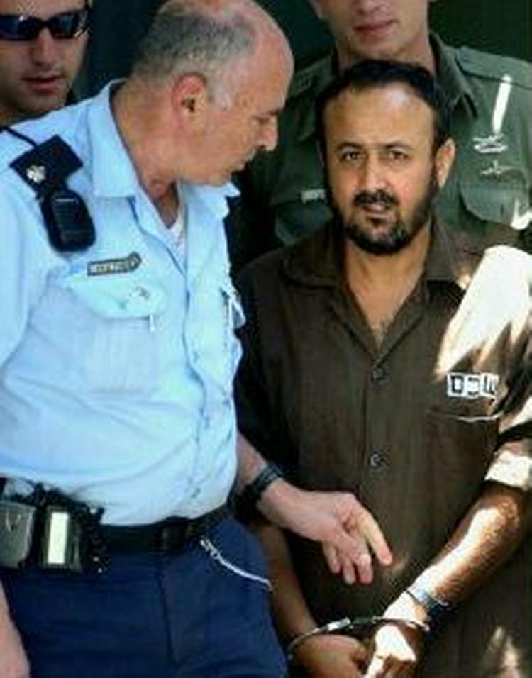 Barghouti sidder i en enecelle i et israelsk fængsel, idømt fem gange livsvarigt fængsel. - Arkivfoto: AP 