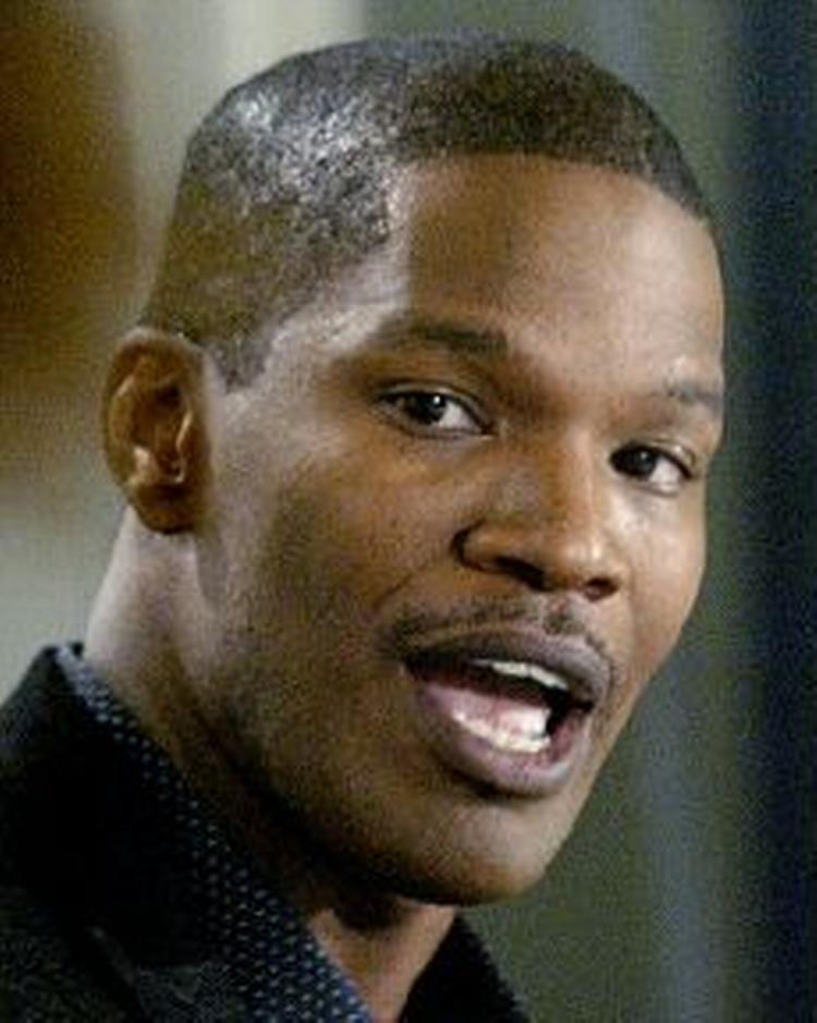 Jamie Foxx er nomineret til tre Golden Globes, blandt andet for sin rolle som musikeren Ray Charles i filmen 'Ray'. - Foto: AP 