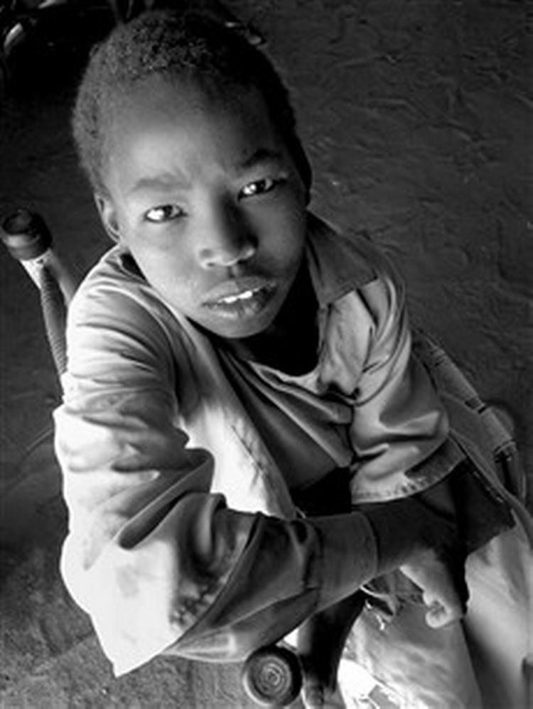 Hamid på 12 år: »Jeg vil ikke blive i Sudan. For her er krig«.   Foto: Jesper Strudsholm 