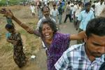 Kvinden her fra byen Cuddalore i Inden mistede sin søn under flodbølgen. - Foto: AP 