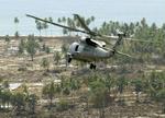 En amerikansk militærhelikopter hjælper med nødhjælpsarbejdet i Aceh-provinsen på Sumatra. Med udgangen af marts er det slut. - Foto: AP 