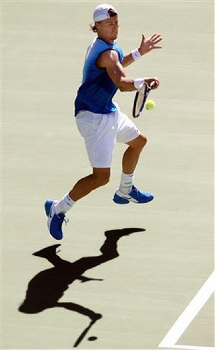 Lleyton Hewitt skal strække sig langt, hvis han skal bryde Australiens sejrstørke og vinde en grand slam på hjemmebane.   Foto: Pat Sullivan/AP 