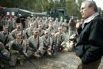 Donald Rumsfeld, der her taler til en gruppe marinesoldater, har to gange sagt op. - Foto: AP 