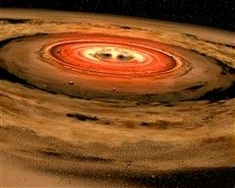 En kunstnerisk fremstilling af gas- og støvskyen, der blev fundet omkring den brune dværg OTS44, af Spitzerteleskopet. Astronomer mener at de her er vidner til skabelsen af et lille solsystem. - Foto- NASA/JPL 