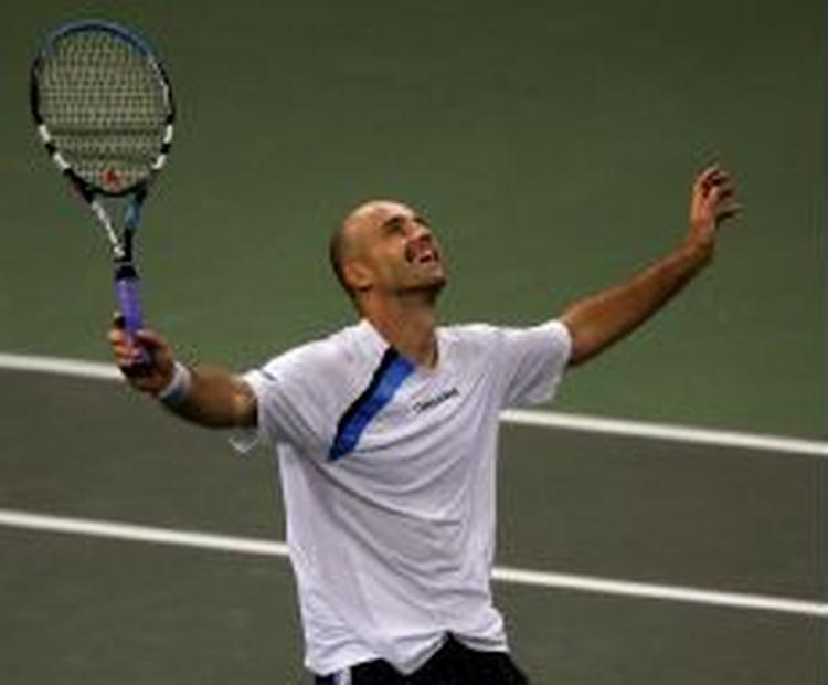 Ljubicic jubler efter sejren over Andy Roddick. - Foto: AP 