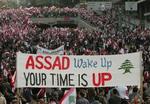 Tusindvis af demonstranter har i dag æret den myrdede Rafik Hariri i Beirut. - Foto: AP 