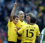 En handlingsplan er klar for Borussia Dortmund. Her et vinderbillede med klubbens danske spiller Niclas Jensen med ryggen til. - Arkivfoto: AP 