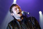 Damon Albarn og resten af Gorillaz har grund til at være glade for den nye opgørelsesmetode af hitlisten. - Foto: AP 