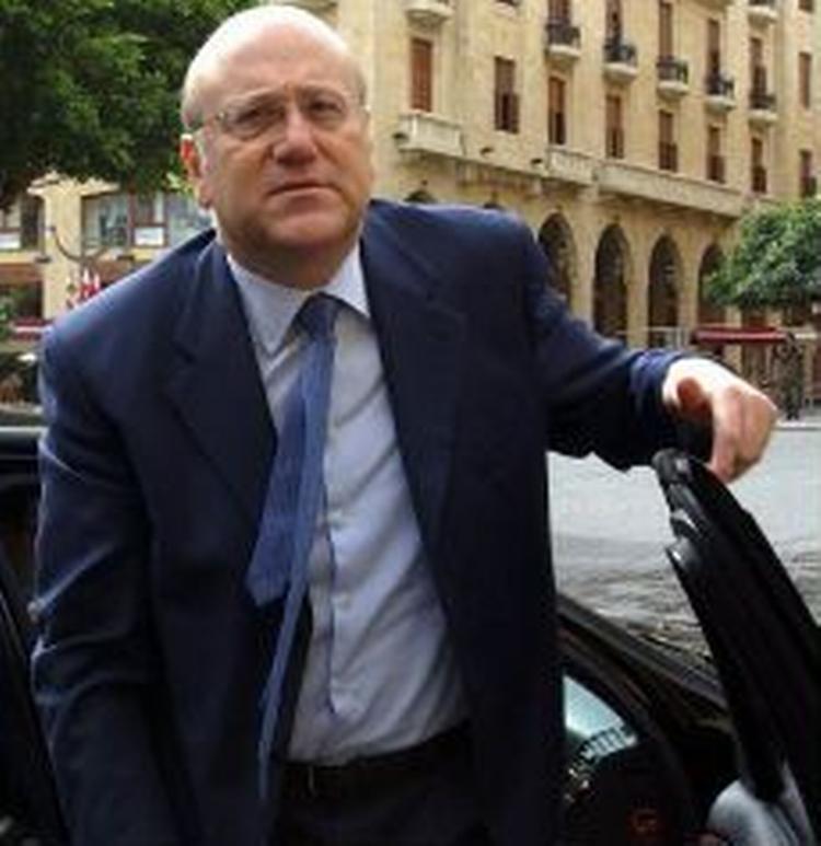 Premierminister Mikati lover at fyre landets hårdt kritiserede, prosyriske sikkerhedschefer. - Foto: AP 