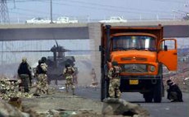 De internationale styrker i Irak skal til at forberede sig på mulige kemiske angreb fra oprørere. - Foto: AP 