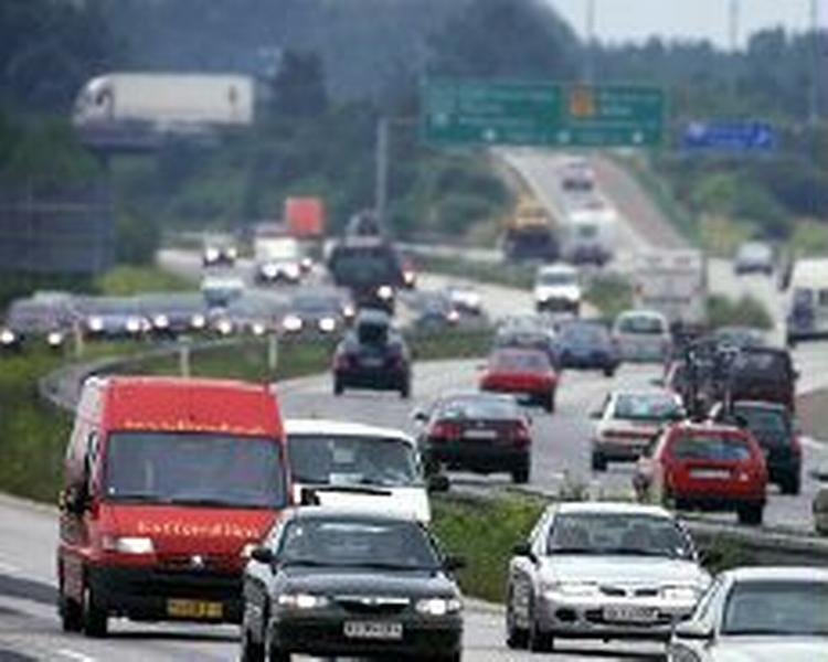 Hver dansker sidder i gennemsnit bag rattet eller som passagerer i en bil næsten 13.000 kilometer om året. - Arkivfoto: Jens Dresling 
