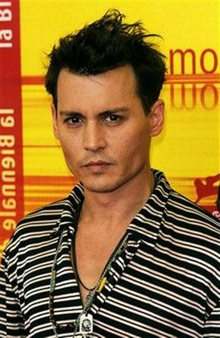 Johnny Depp kommer op på et grillspyd i fortsættelsen til 'Pirates of the Carribean'. - Foto AP 