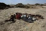 Omkring 200 har mistet livet, siden Iraks regering blev dannet i sidste uge. Her på en losseplads i Bagdad blev der i morges fundet 14 lig. - Foto: AP 