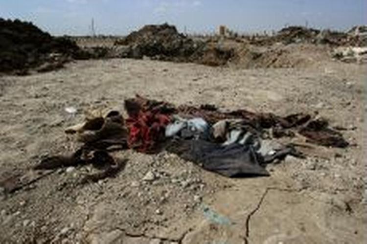 Omkring 200 har mistet livet, siden Iraks regering blev dannet i sidste uge. Her på en losseplads i Bagdad blev der i morges fundet 14 lig. - Foto: AP 